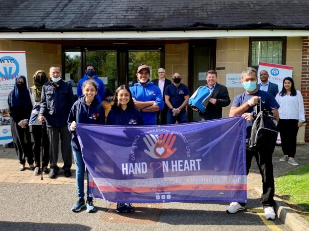 Dean Russell with Afzal Pradhan and Watford-based Hand on Heart team