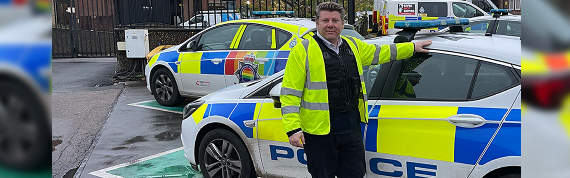 Dean Russell MP standing by police car at Watford Police Station