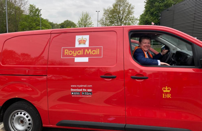 Dean Russell in an electric Post Office van