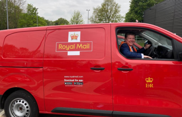 Dean Russell in an electric Post Office van