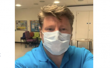 Dean Russell volunteering in Watford General Hospital